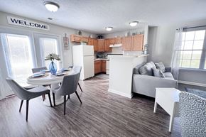 Georgetown triplex for rent - A kitchen with a dining table and chairs.