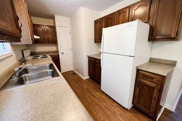 West Chester triplex for rent - a kitchen with a white refrigerator and a sink