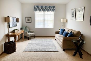 A living room with a couch and a table