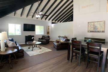 Cincinnati apartment for rent - a living room and dining room with a couch and a table
