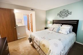 Cincinnati apartment for rent - a bedroom with a bed and a door to a bathroom at The Vinings Apartments, Cincinnati, OH, 45245