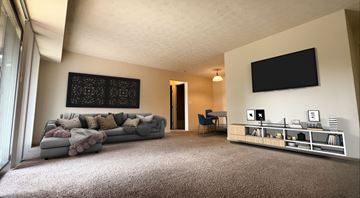Cincinnati apartment for rent - a living room with a couch and a tv