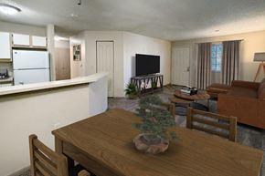 Galloway apartment for rent - A living room with a couch, a television, and a dining table.