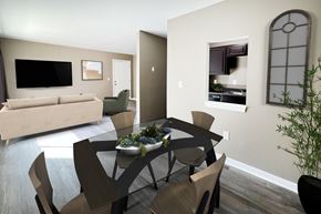 Hamilton apartment for rent - A modern dining room with a wooden table and chairs.