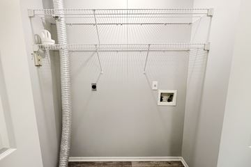 Galloway apartment for rent - A white closet with a white pipe and a white shelf.