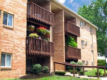 A brick apartment building with balconies