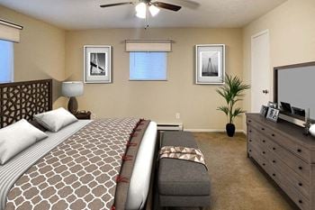A bedroom with a bed and a dresser