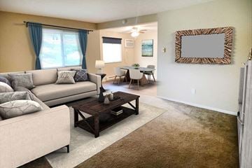 Cincinnati apartment for rent - a living room with a couch and a table