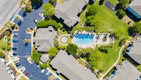Gulf Shores apartment for rent - A bird's eye view of a neighborhood with a pool and a playground.
