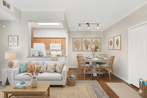 Gulf Shores apartment for rent - A well-lit, modern living room with a dining area and a kitchen in the background.