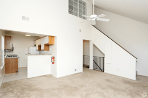 Manassas apartment for rent - an empty living room with white walls and a ceiling fan