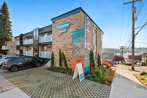 Seattle apartment for rent - a brick building with a mural on the side of it