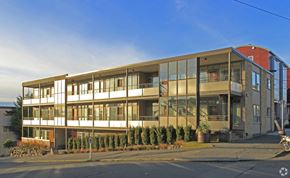 Seattle apartment for rent - a large apartment building on the side of a street