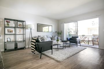 Torrance apartment for rent - a living room with a couch and chairs and a rug