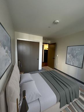Honolulu apartment for rent - a bedroom with a bed and a door to a bathroom