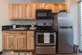 Honolulu apartment for rent - Kewalo Apartments kitchen area with appliances, counters, and cabinets