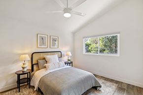 Torrance apartment for rent - a bedroom with a bed and a ceiling fan