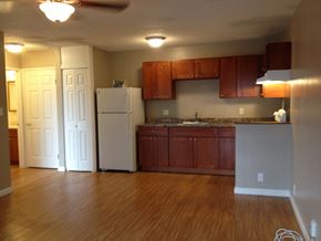 Lahaina apartment for rent - Coconut Inn kitchen area with refrigerator, cabinets, and counters
