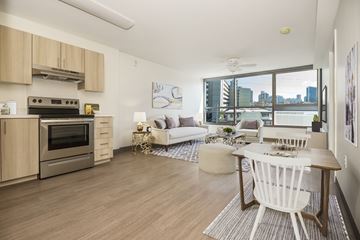 Honolulu apartment for rent - a living room with a kitchen and a dining table
