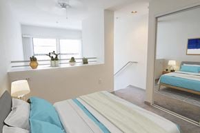 Santa Monica apartment for rent - a bedroom with a bed and a mirror and a window