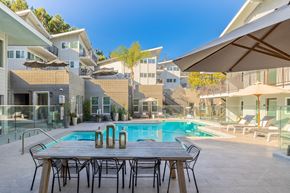Torrance apartment for rent - a table and chairs next to a swimming pool