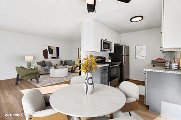 El Cajon apartment for rent - A modern kitchen with a dining table and chairs.