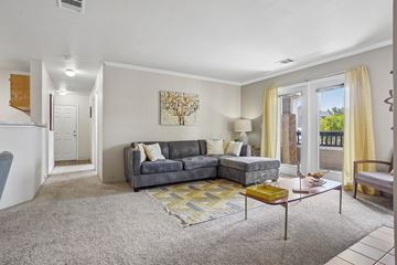 Castle Rock apartment for rent - A living room with a grey couch and a yellow coffee table.