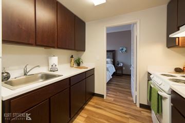 Kapolei apartment for rent - a kitchen with a sink and a stove and a door to a bedroom