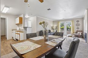 Castle Rock apartment for rent - Pines at Castle Rock 1713 dining room with a wooden table and chairs.