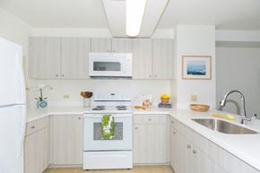 Honolulu apartment for rent - Kanekapolei Collection Kitchen area with appliances, cabinet, and counters