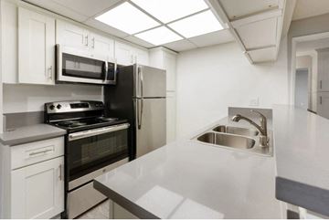 Van Nuys apartment for rent - a kitchen with stainless steel appliances and a sink