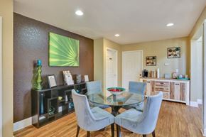 Fort Collins apartment for rent - A dining room with a glass table and grey chairs.