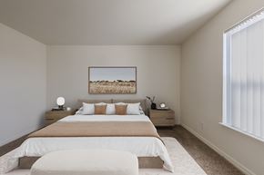 Fort Collins apartment for rent - A bedroom with a large bed and a painting on the wall.