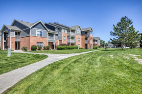 Englewood apartment for rent - A row of apartment buildings with a grassy area in front.