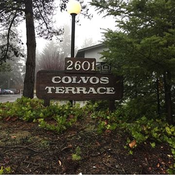 Gig Harbor apartment for rent - a sign for the town of collins terrace in front of trees