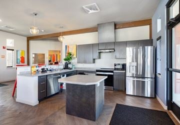 Greeley apartment for rent - A modern kitchen with a large island in the middle.