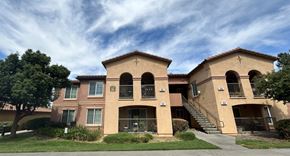 Red Bluff apartment for rent - A large apartment complex with multiple balconies and staircases.