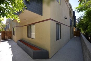 Monarch terrace exterior building pathway and planter