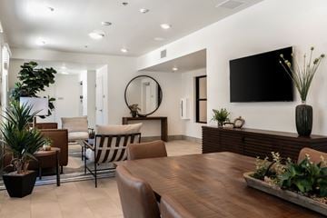Santa Barbara apartment for rent - A modern living room with a wooden table and chairs.
