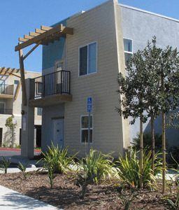 San Ysidro apartment for rent - an apartment building with a balcony and a yard