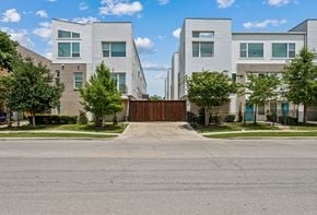 Dallas townhouse for rent - A modern residential area with a gated entrance.