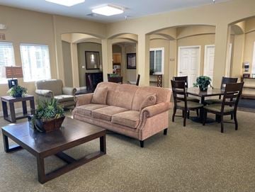 Soledad apartment for rent - A living room with a brown couch and a coffee table.