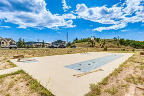 Central City apartment for rent - A basketball court is being constructed in a grassy area.
