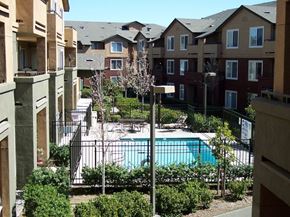 Richmond apartment for rent - an apartment building with a pool in the middle