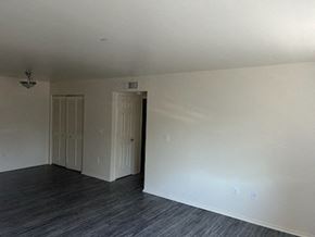 Templeton apartment for rent - A room with two doors and a wooden floor.