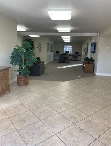 El Centro apartment for rent - A spacious room with tiled flooring and a large window.