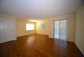 Monarch terrace unfurnished living room with patio sliding doors