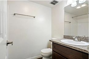 Los Angeles apartment for rent - a bathroom with a sink toilet and a mirror