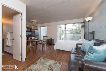 Honolulu apartment for rent - a bedroom and living room with a couch and a bed