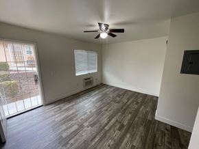 Lemon Grove apartment for rent - an empty living room with a ceiling fan